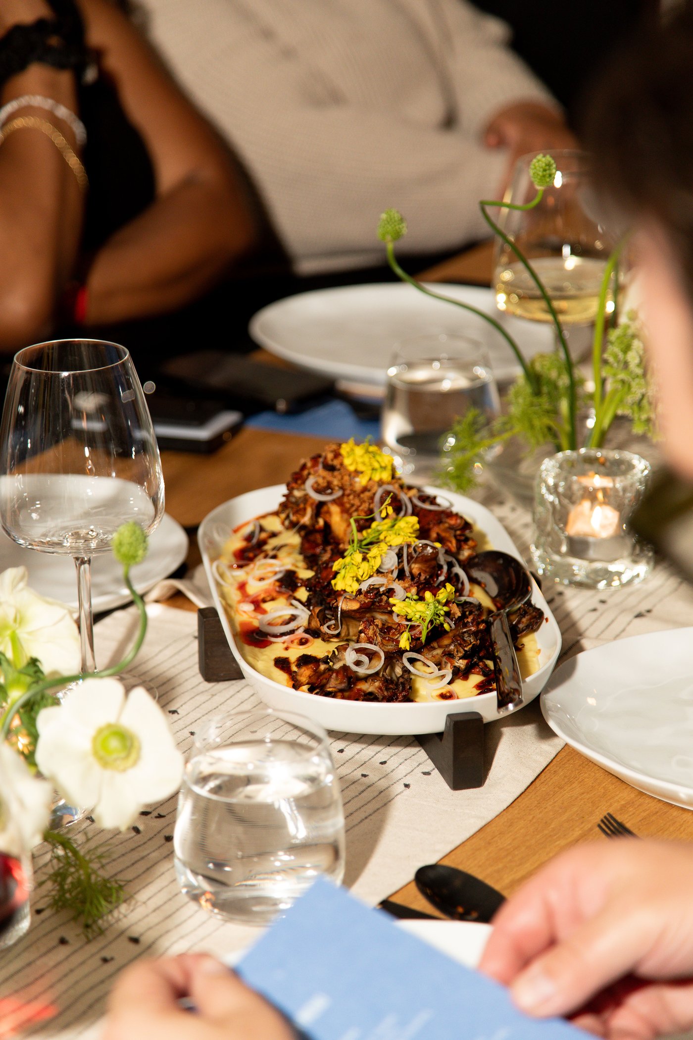 Food on table with floral arrangements