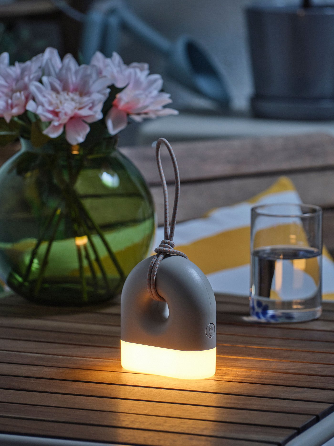 A battery-operated donut-shaped SOLVINDEN table lamp