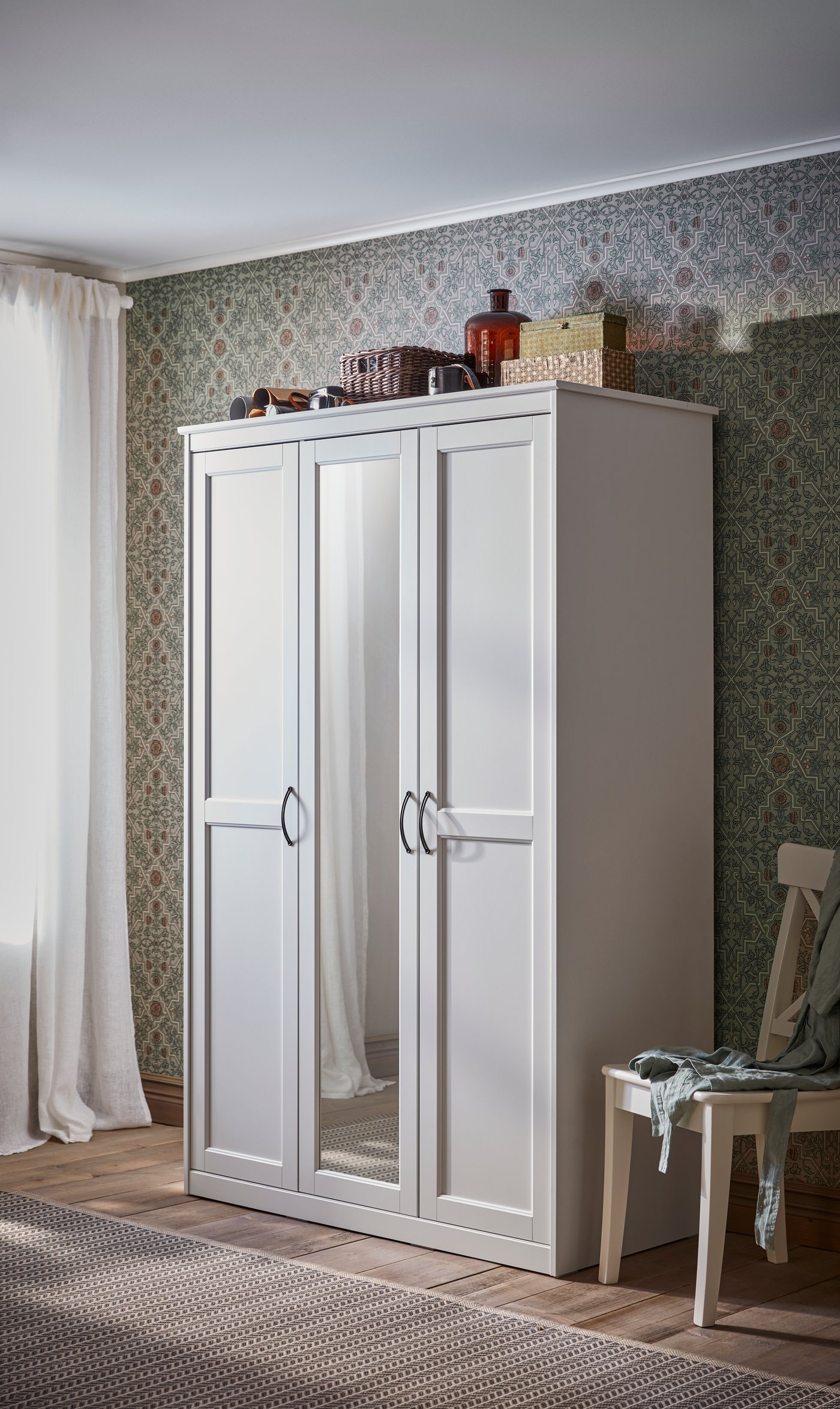 A white INGOLF chair in the bedroom