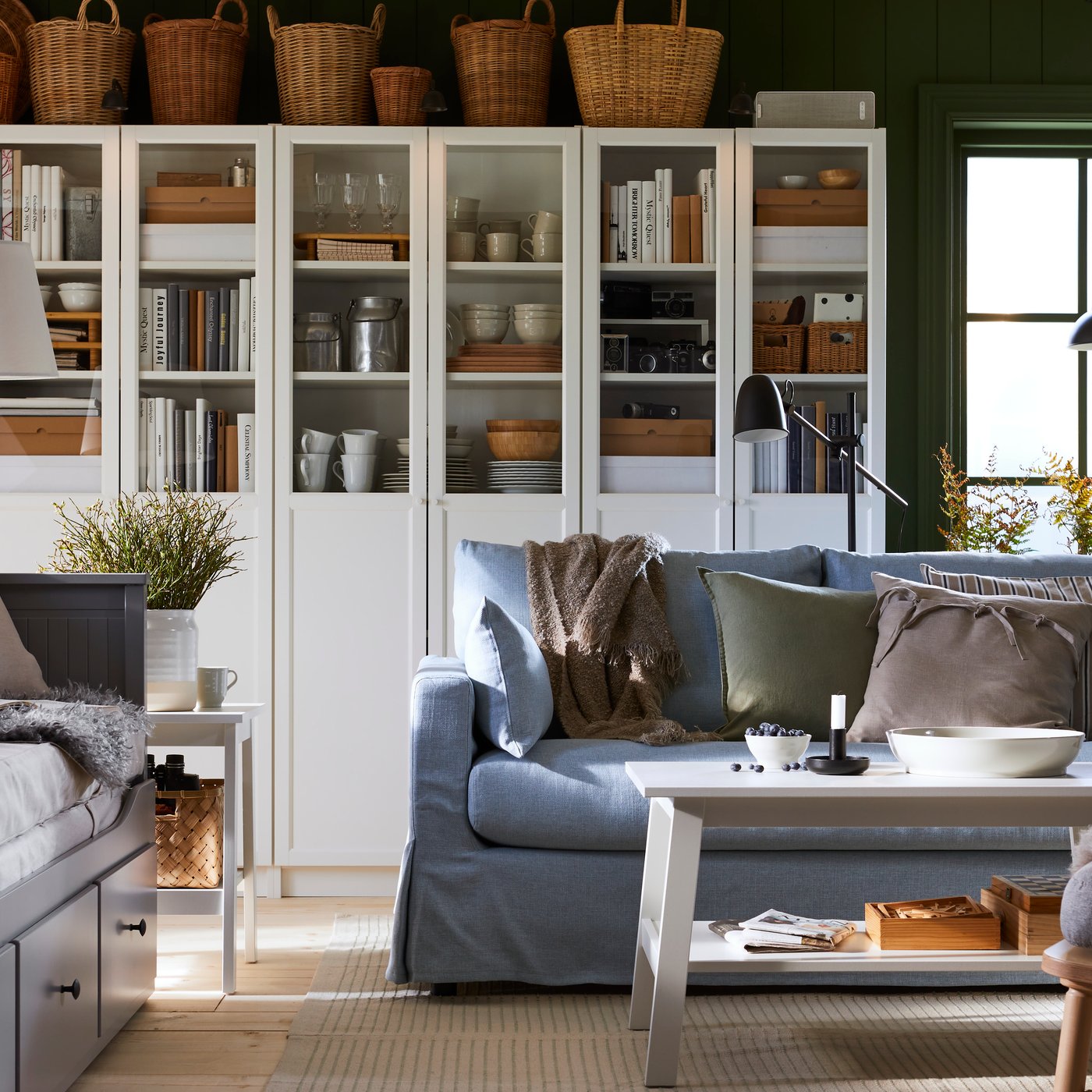 BILLY bookcases and a HYLTARP 2-seat sofa are in a traditional-style living room inspired by Nordic cottages.