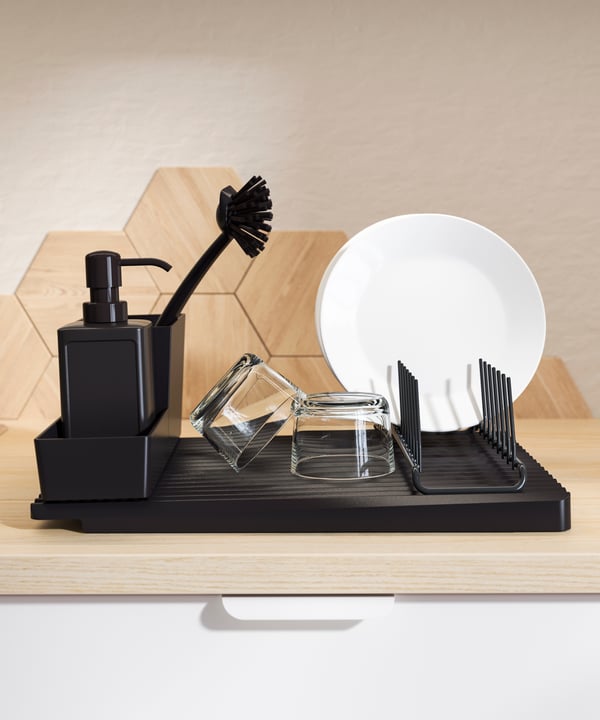 A grey RINNIG soap dispenser in the kitchen