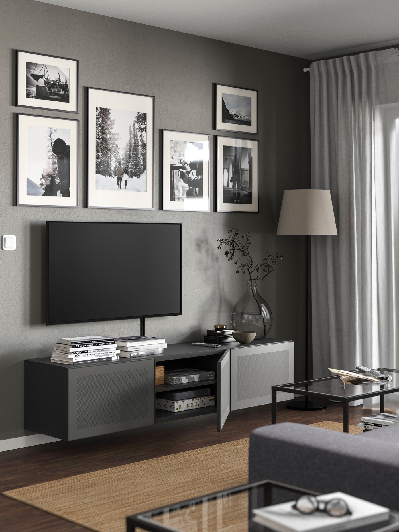 A dark grey/Bergsviken black BESTÅ TV bench with drawers and door