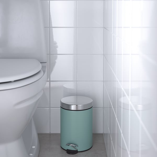 A light grey-turquoise EKOLN waste bin