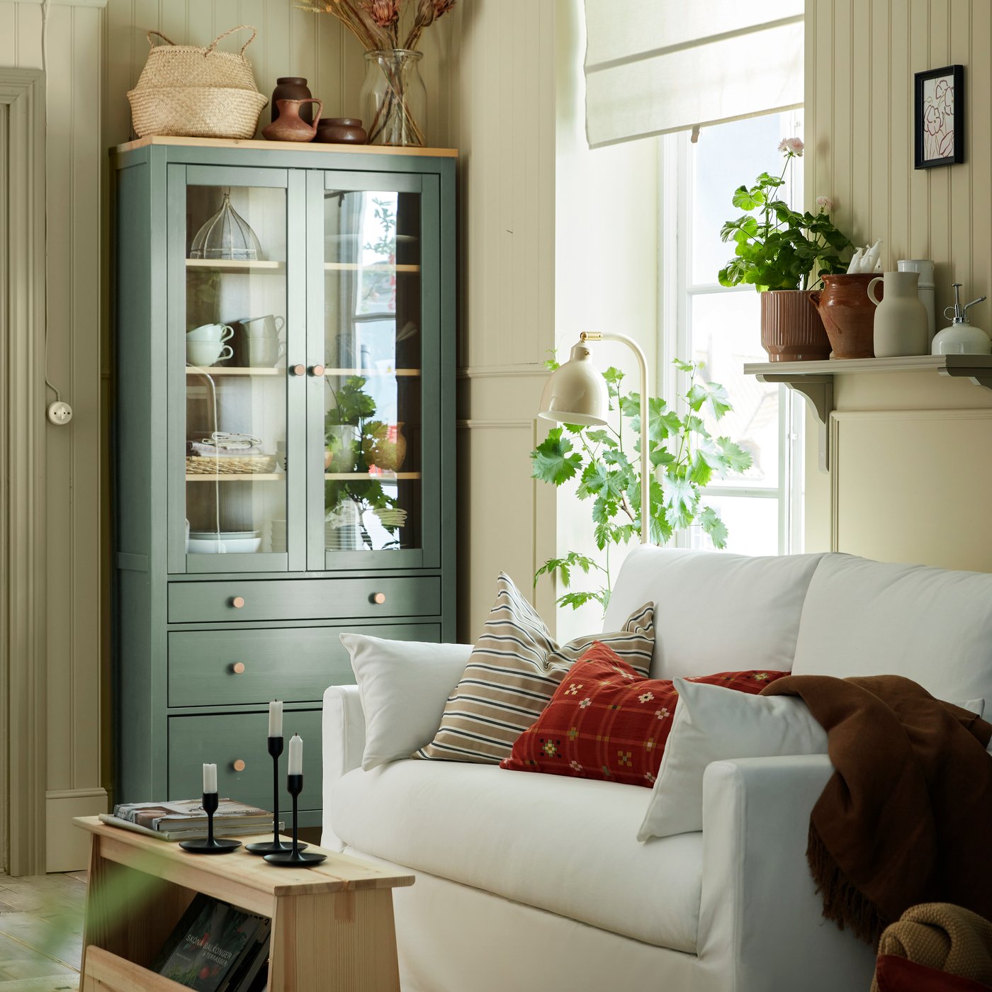 A grey-green/light brown stained HEMNES glass-door cabinet with 3 drawers
