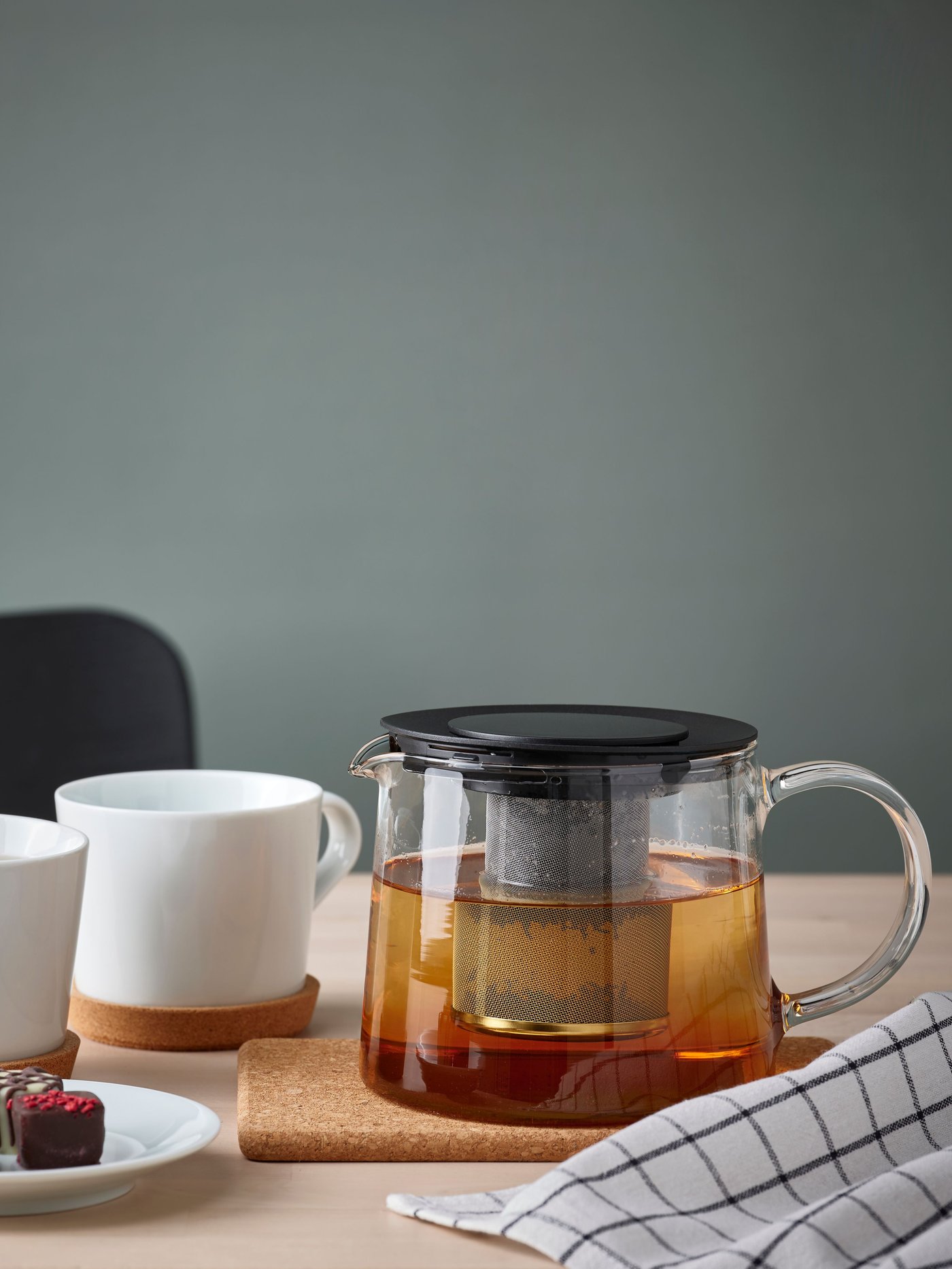 A glass RIKLIG teapot