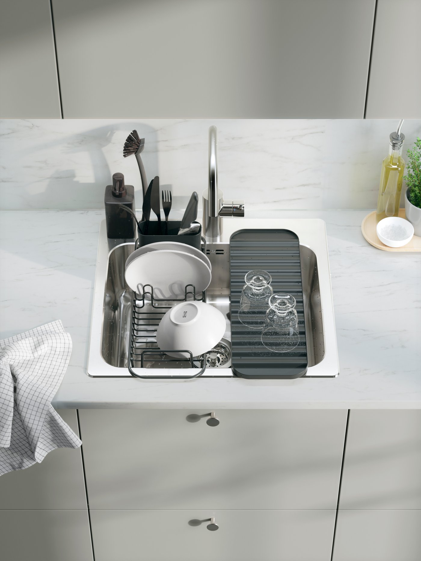 A grey RINNIG soap dispenser in the kitchen