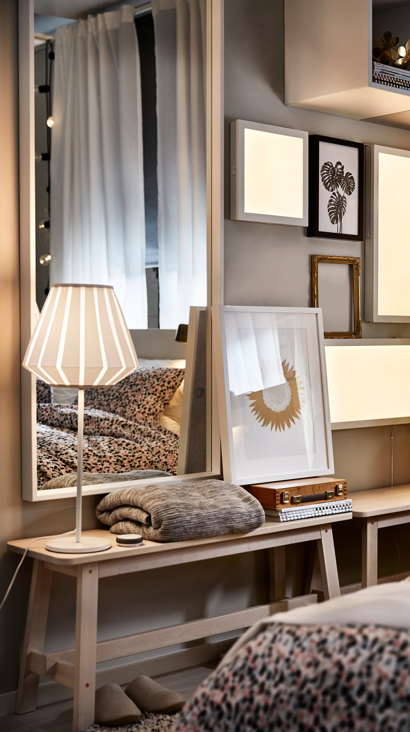 A white NISSEDAL mirror in the bedroom