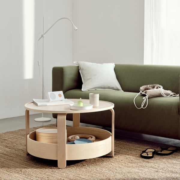 A Vissle yellow-green KLIPPAN cover for 2-seat sofa in the living room