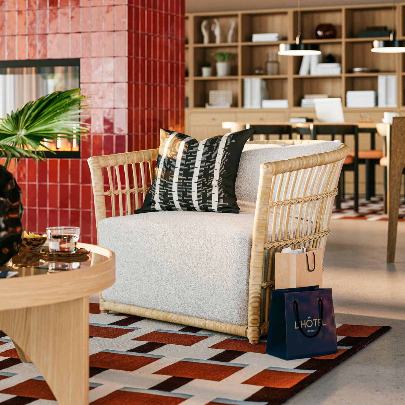 A close-up on STOCKHOLM 2025 grey/white armchair next to a round coffee table in a spacious hotel lobby by a fireplace.