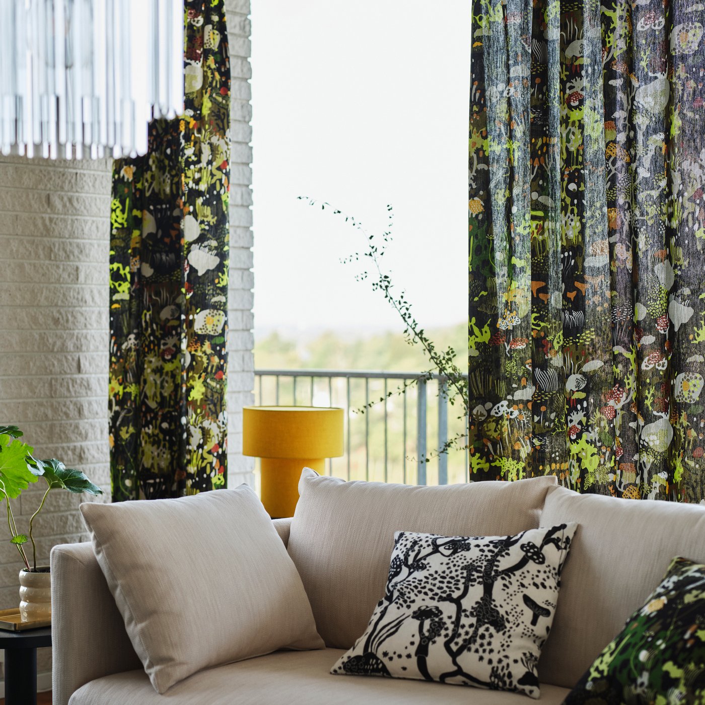 An in/outdoor/beige HASSELBUKETT plant pot in the living room