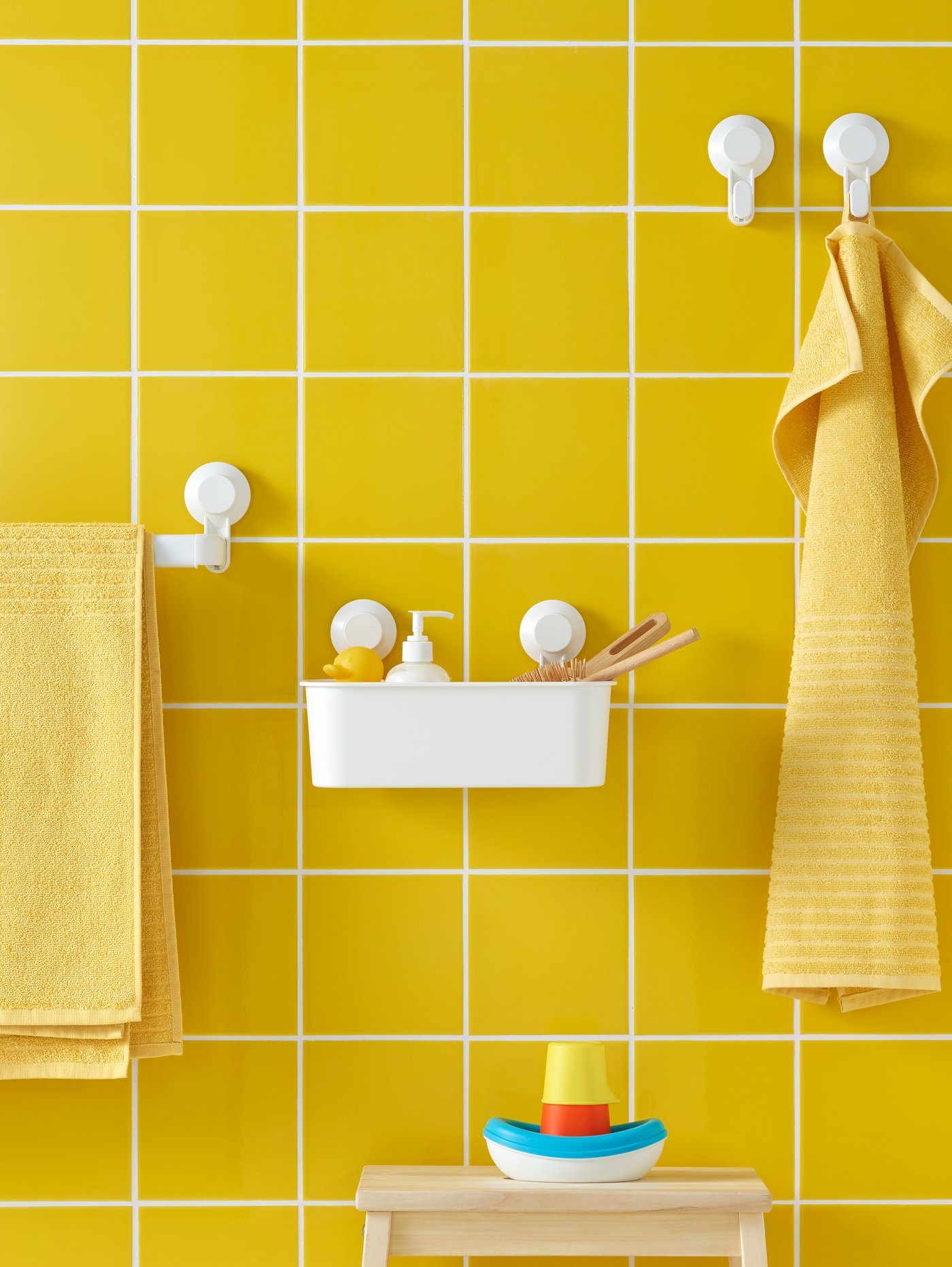 A white TISKEN basket with suction cup