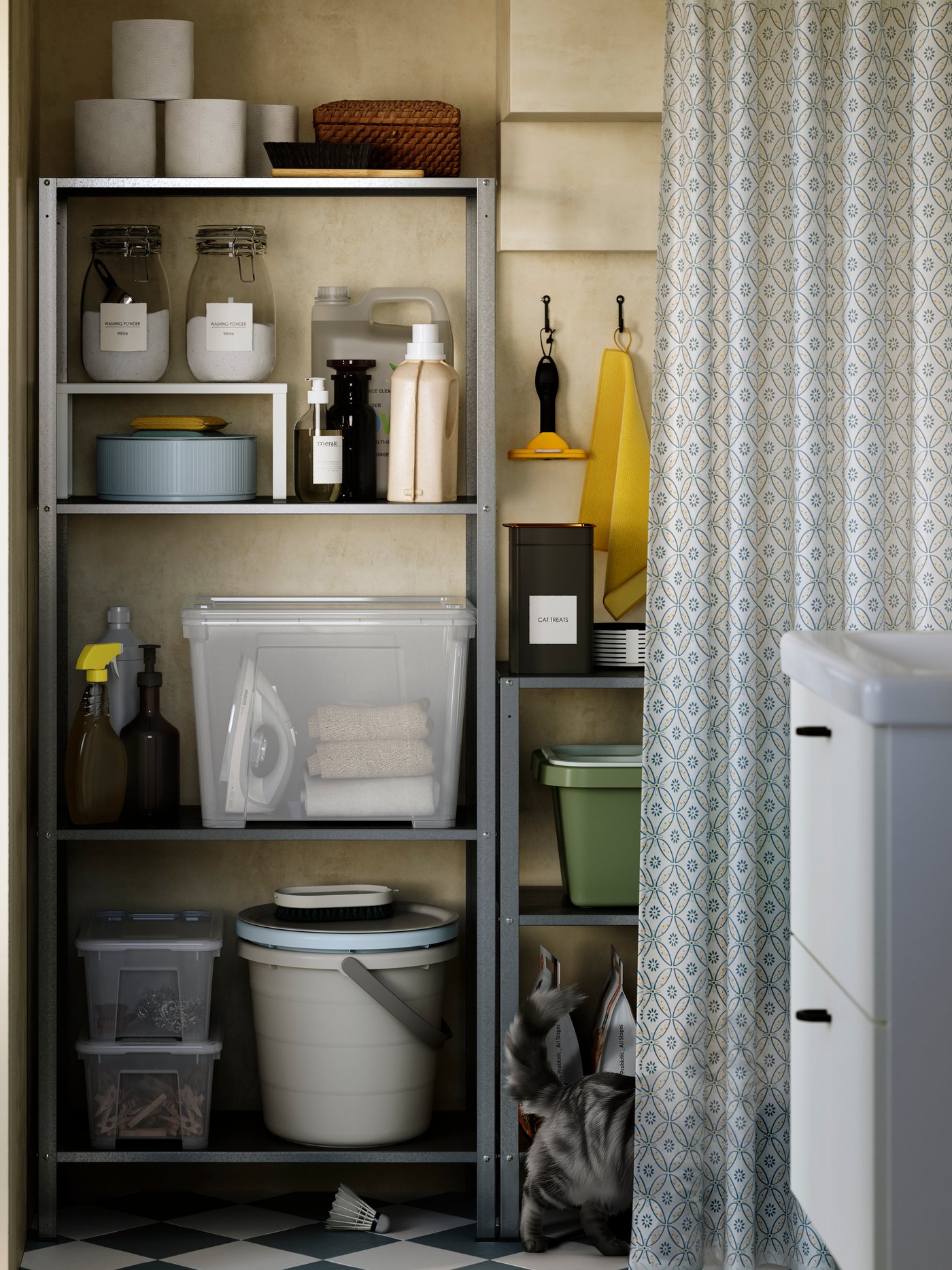 A galvanised steel HYLLIS in/outdoor shelving unit holds cleaning supplies and toilet paper rolls in a small bathroom.
