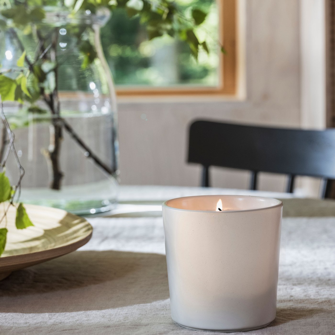 A Scandinavian Woods/white ADLAD scented candle in ceramic jar