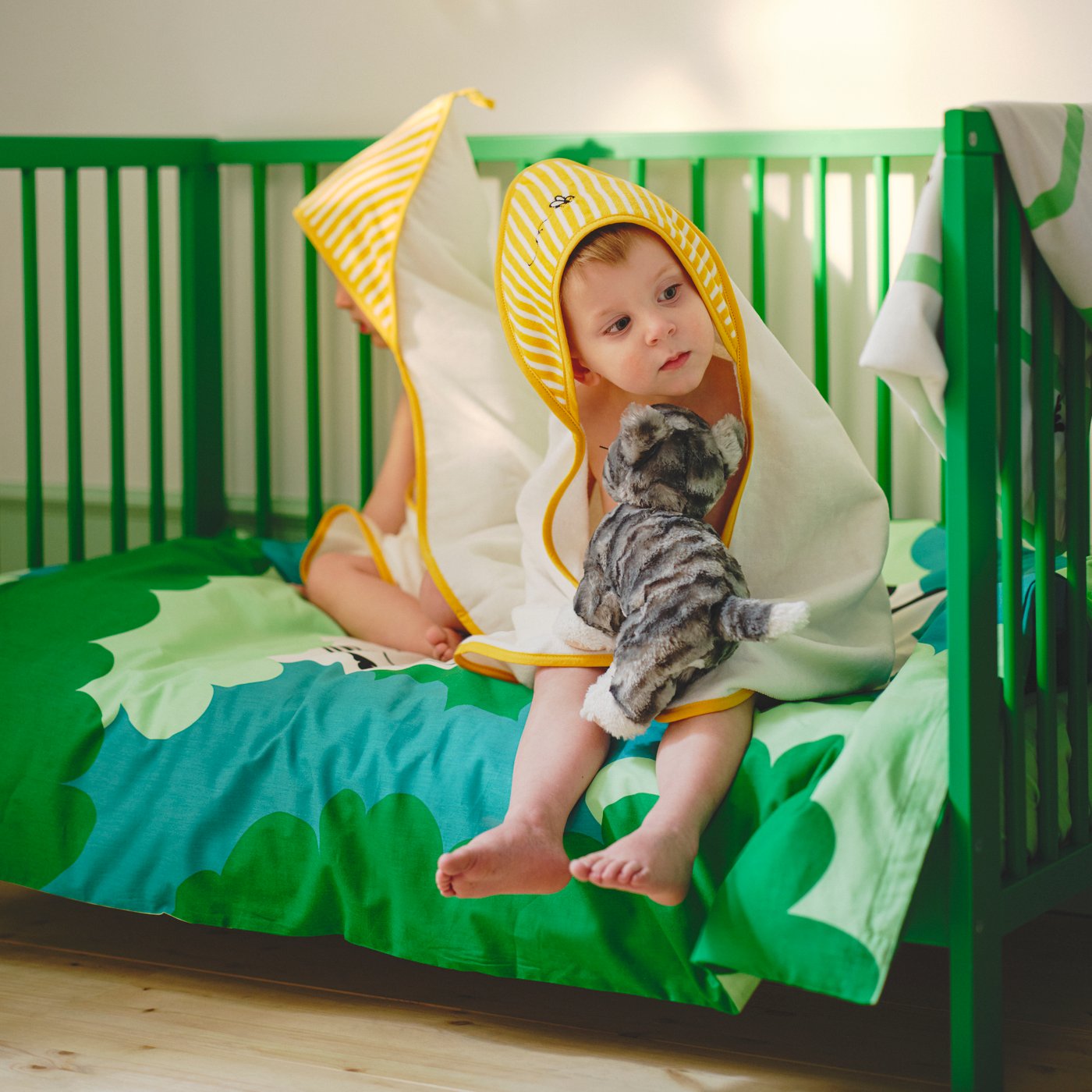 A cat grey/white LILLEPLUTT soft toy in the childrens room