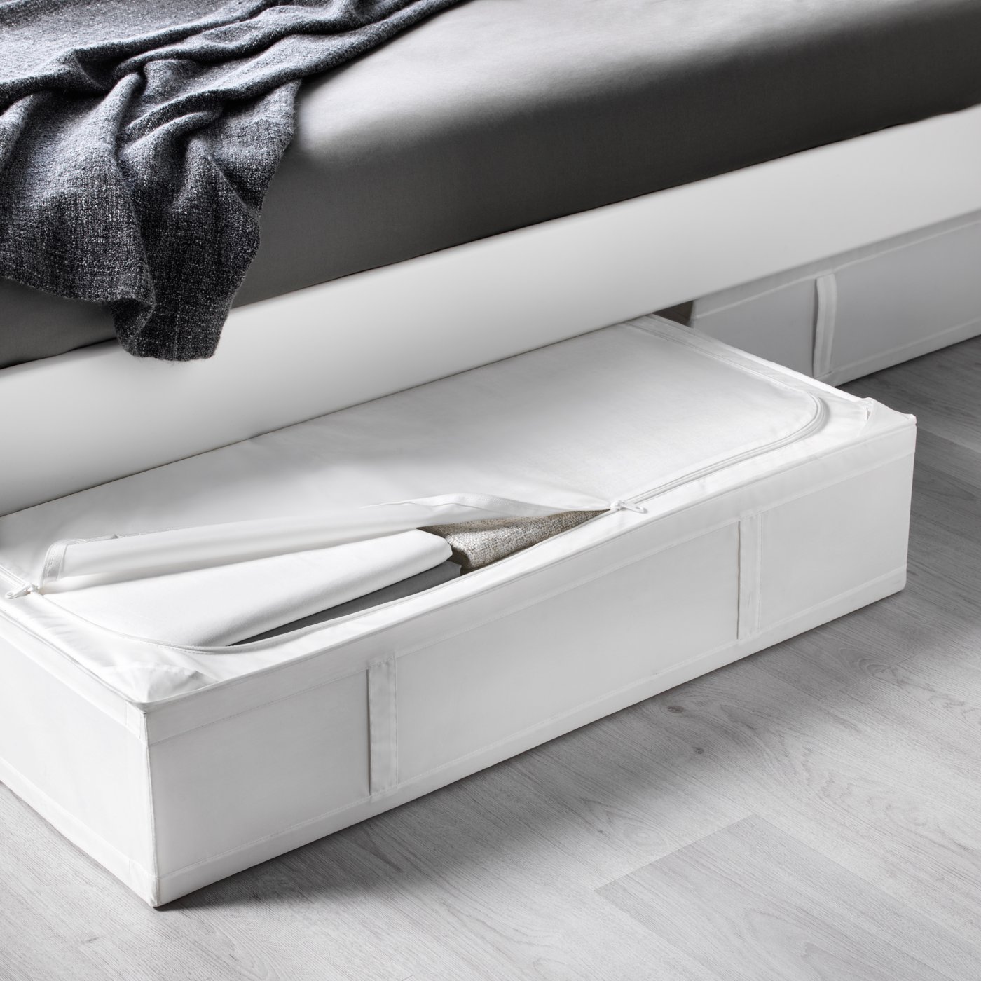 A white SKUBB storage case in the bedroom