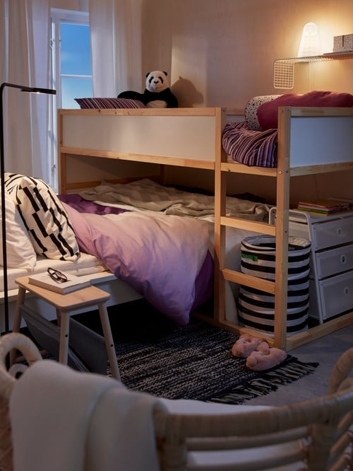 Bedroom with bed frame, reversible bed, duvet cover, pillowcases, cushion covers, basket, soft toy, wall shelf, stool, rug.