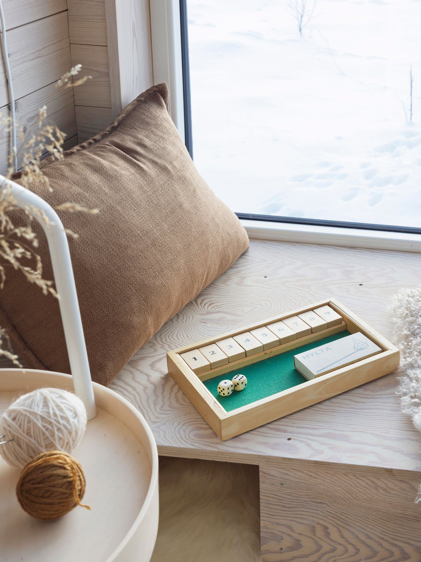 A light brown LAGERPOPPEL cushion cover