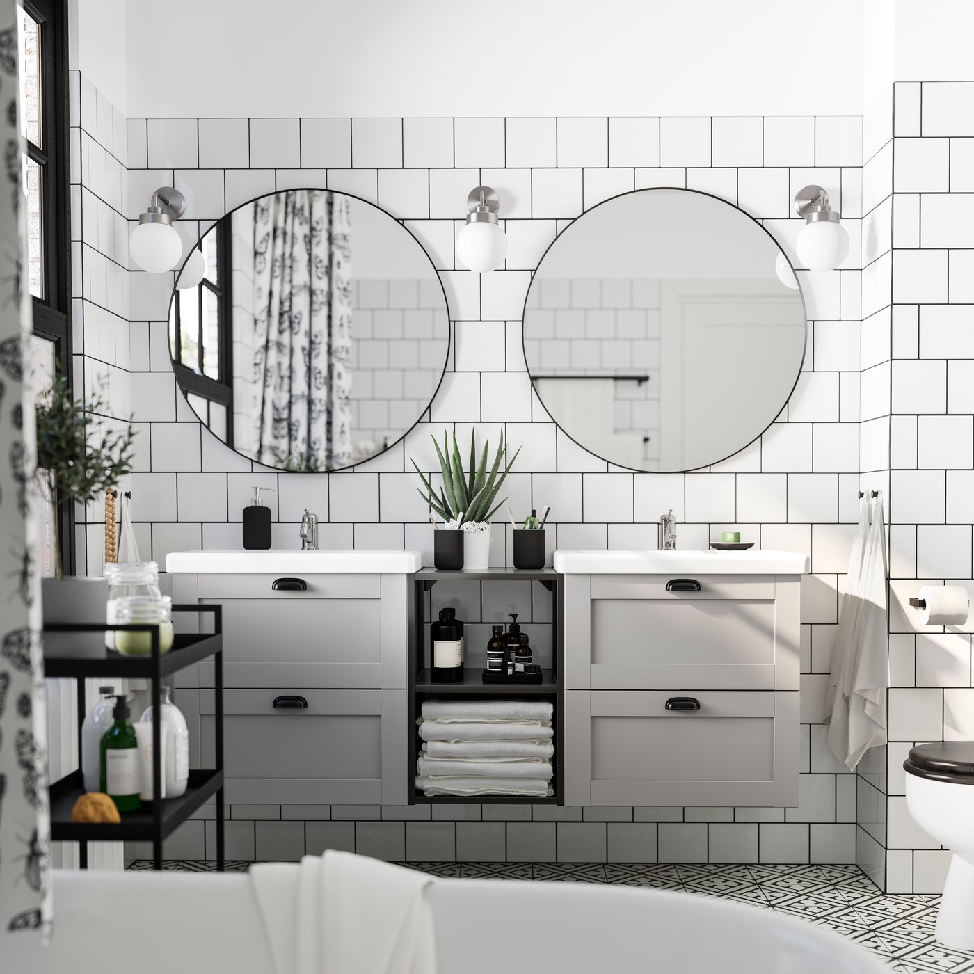 A black NISSAFORS trolley in the bathroom