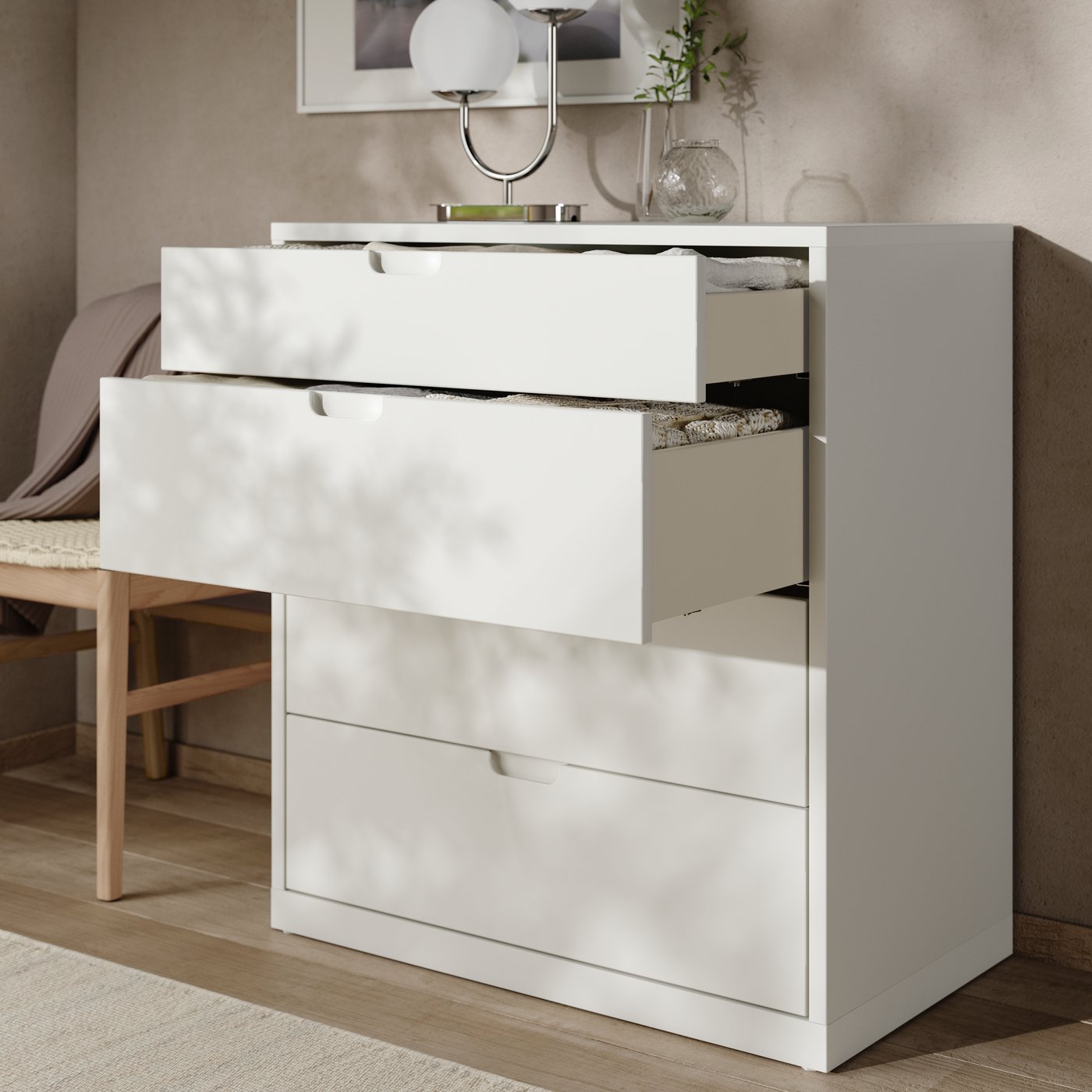 An off-white TONSTAD chest of 4 drawers