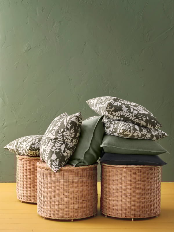 A grey-green/white ROTVECKLARE cushion cover