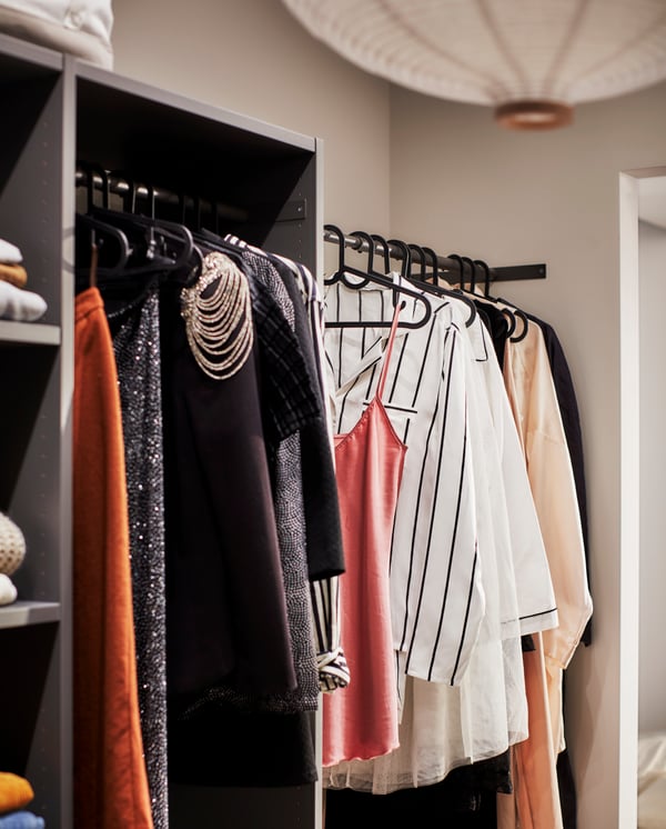 A dark grey AURDAL wardrobe combination in the bedroom