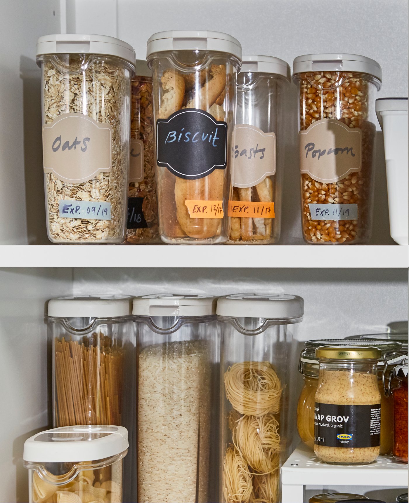 A white UTRUSTA shelf in the kitchen