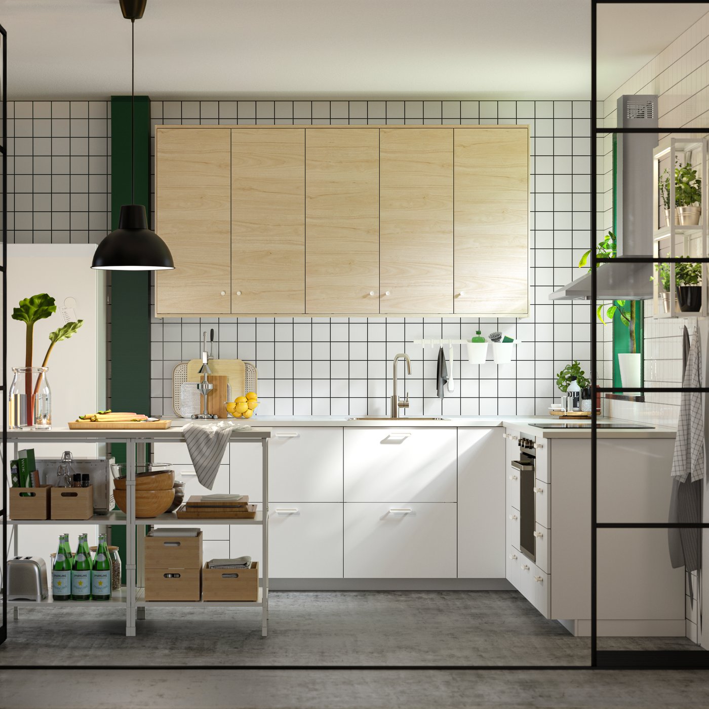 A white VALLSTENA drawer front in the kitchen