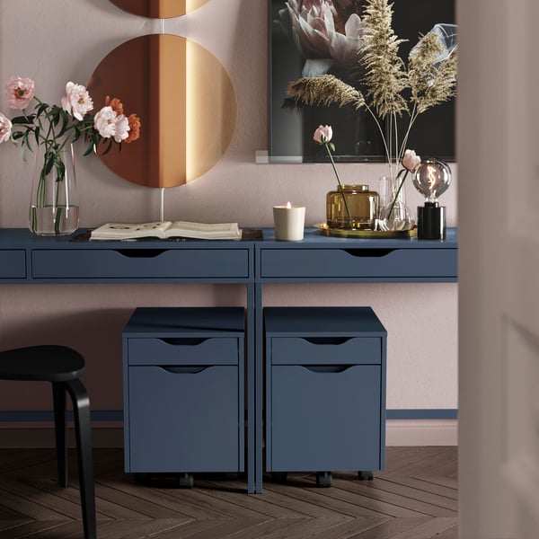 Two black-blue ALEX desks with each a small drawer unit on casters underneath.