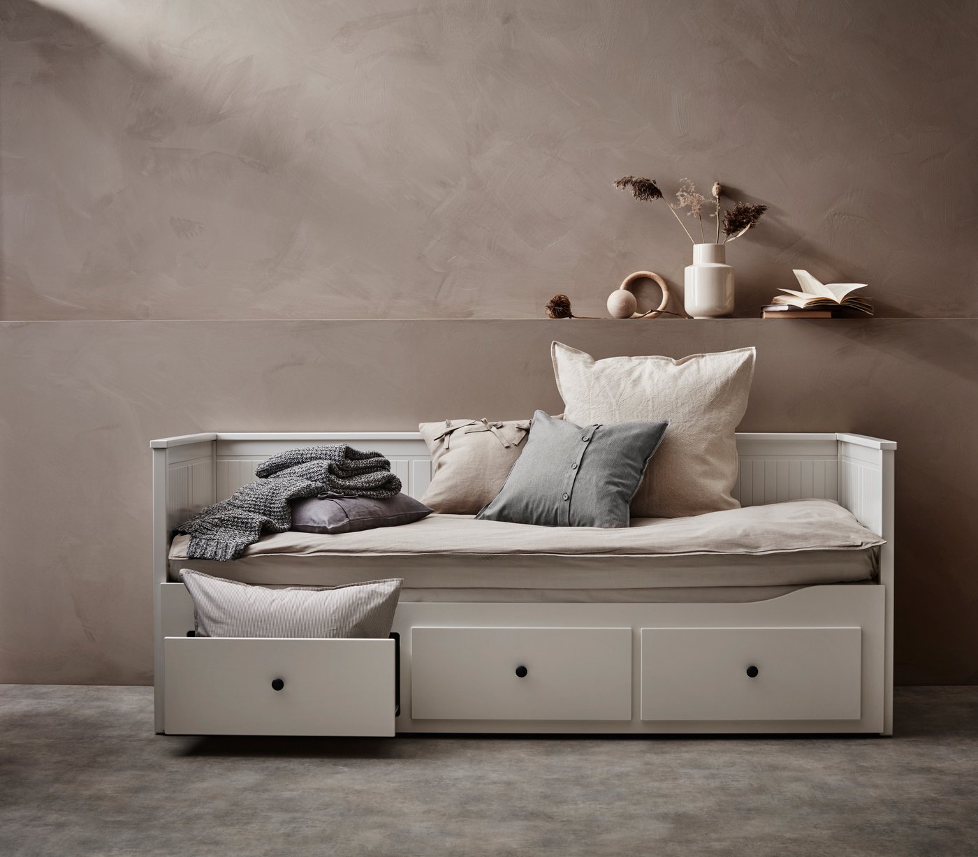 HEMNES bed in beige room with pillows