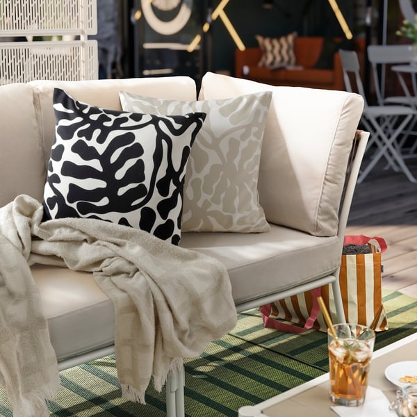 A beige white/outdoor indoor  GRÖNKNAVEL cushion cover