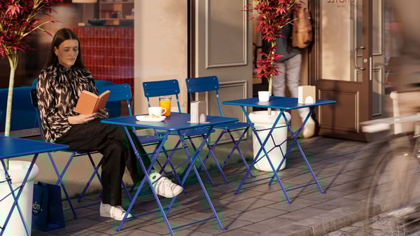 A light grey-brown SKOGSRÖR napkin holder outside