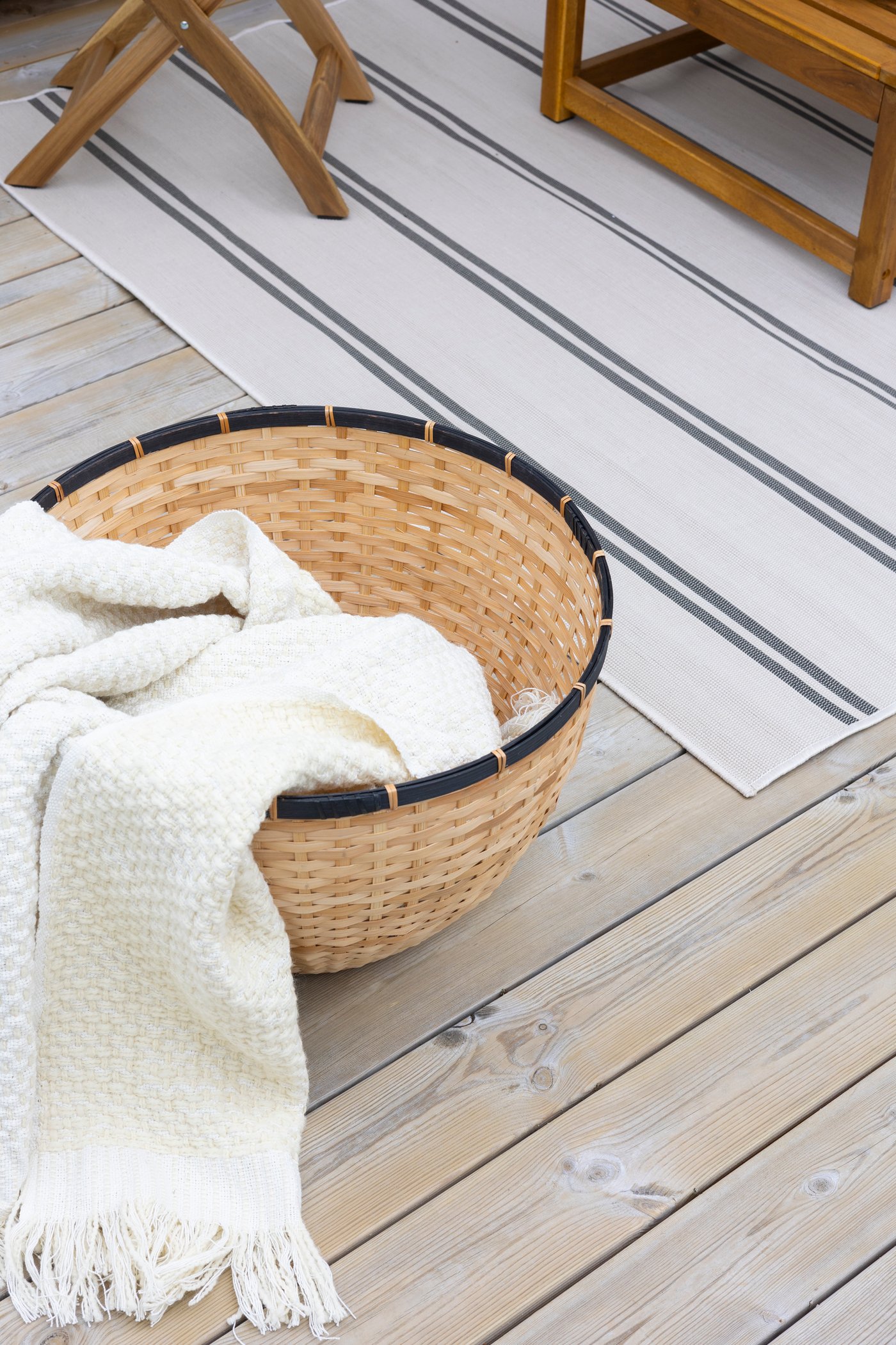 An off-white HORNMAL throw