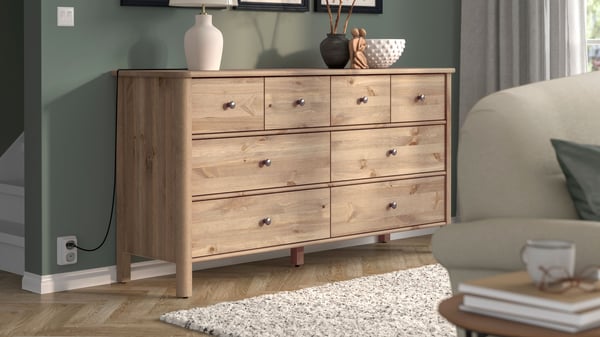 A grey-brown stained STOREMOLLA chest of 8 drawers