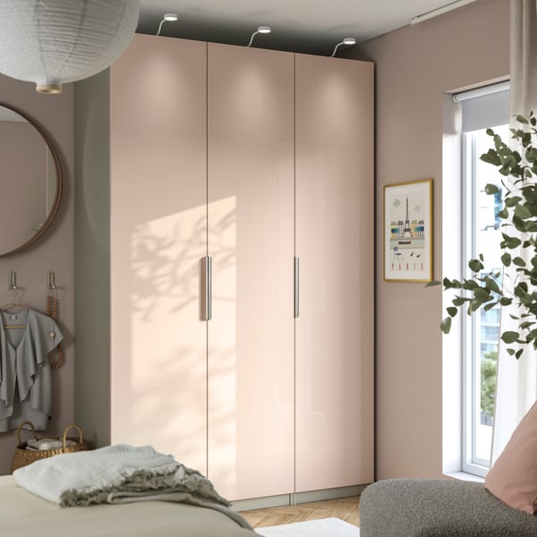 A grey-beige/high-gloss light orange FARDAL wardrobe combination