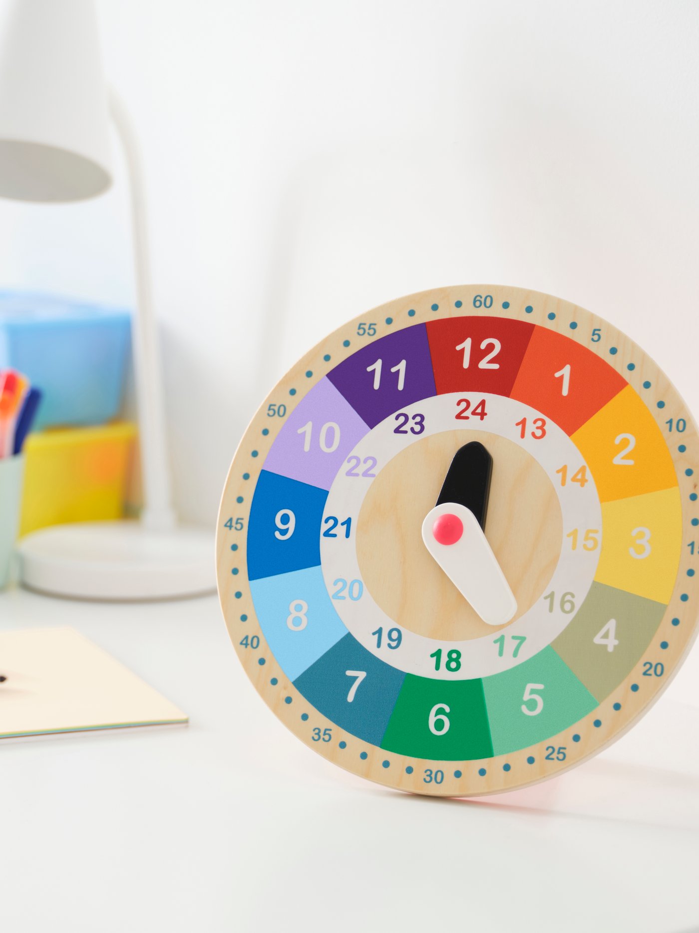 A multicolour UNDERHÅLLA educational wooden clock