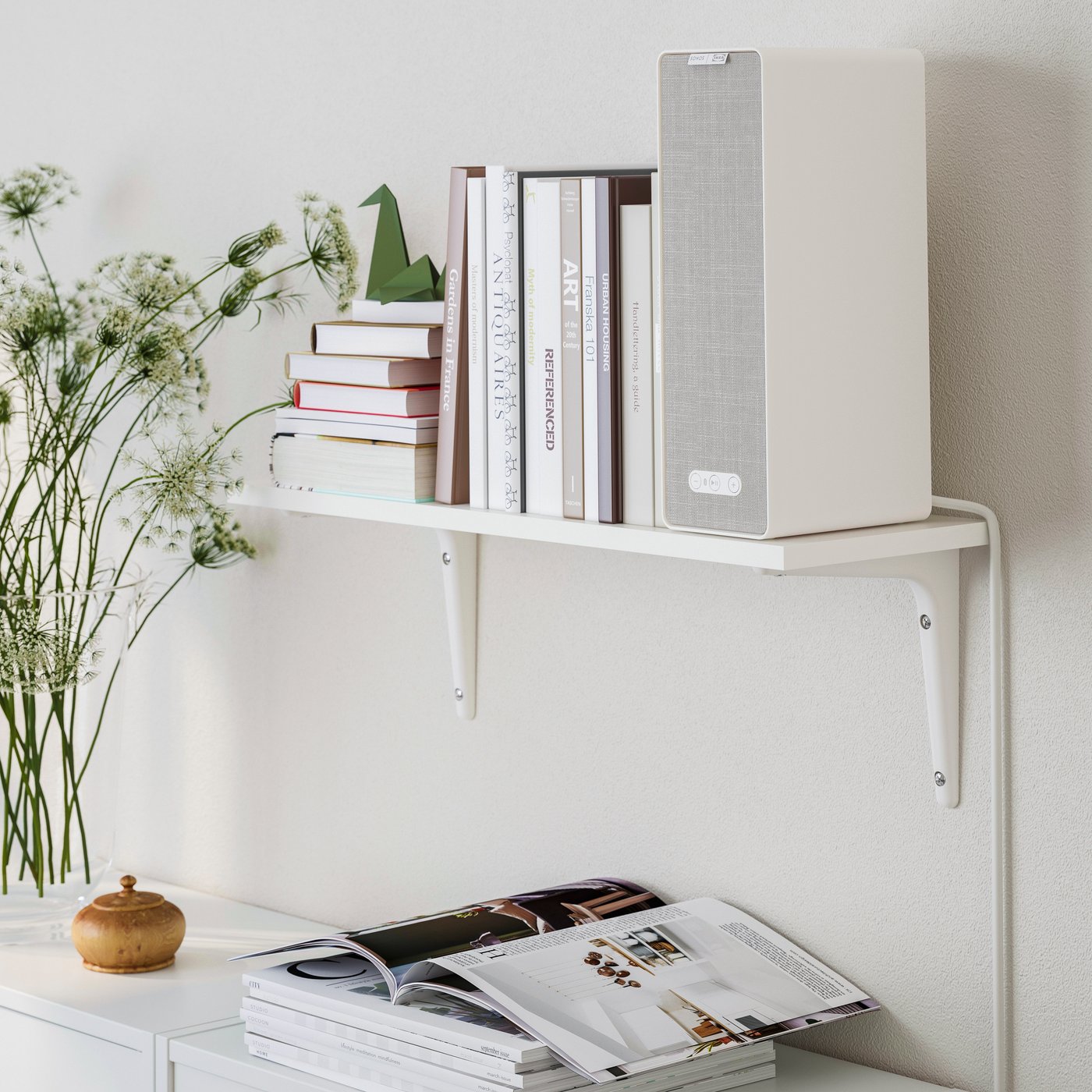 A white/white SIBBHULT wall shelf