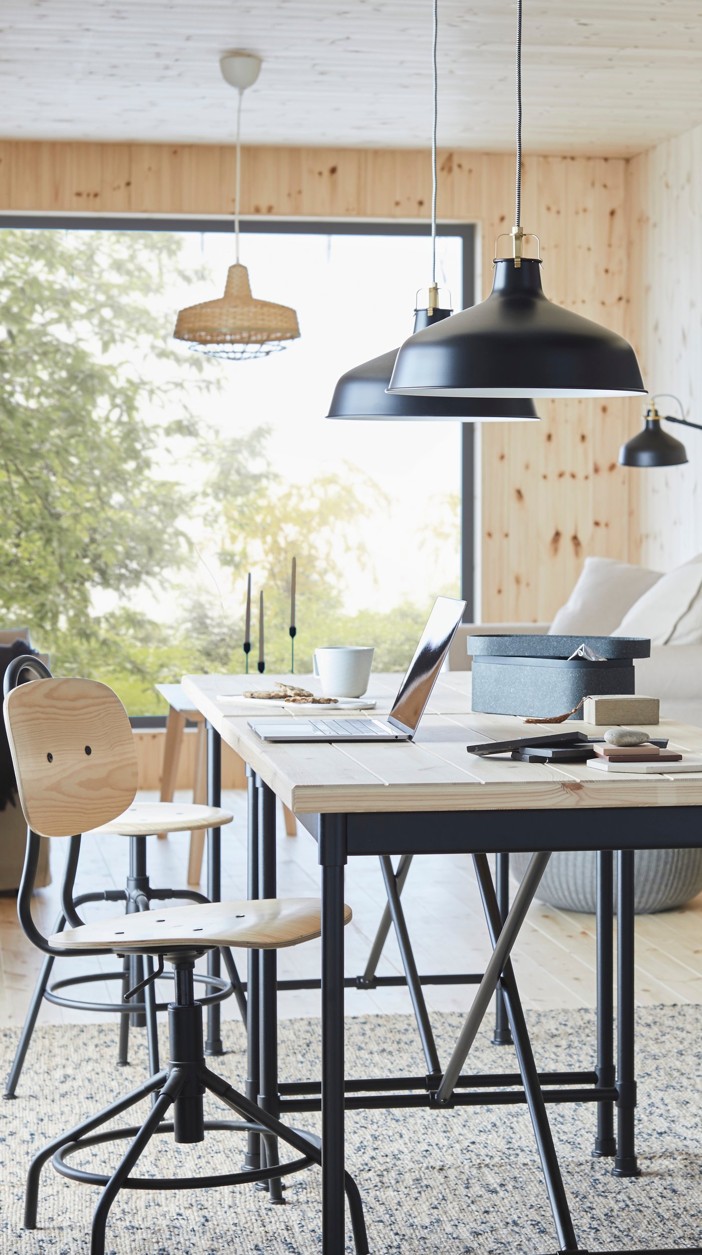 A pine/black KULLABERG swivel chair in the home office