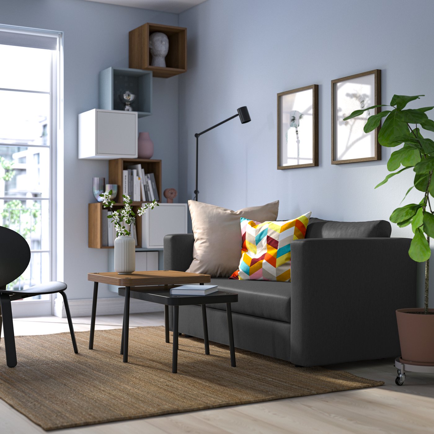 A Knisa dark grey SKÖNABÄCK 2-seat sofa-bed in the living room