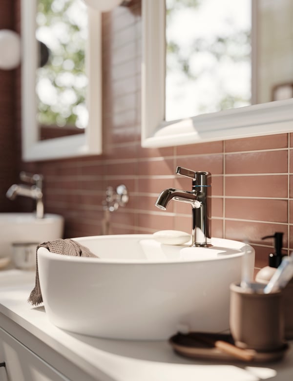 A white TOFTBYN mirror in the bathroom