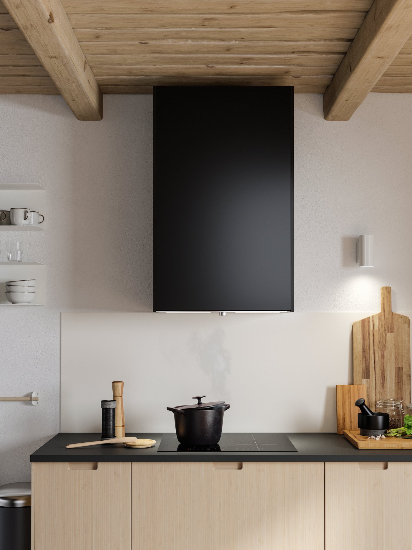 Una cocina con una campana extractora de acero inoxidable gris sobre una placa de inducción negra.