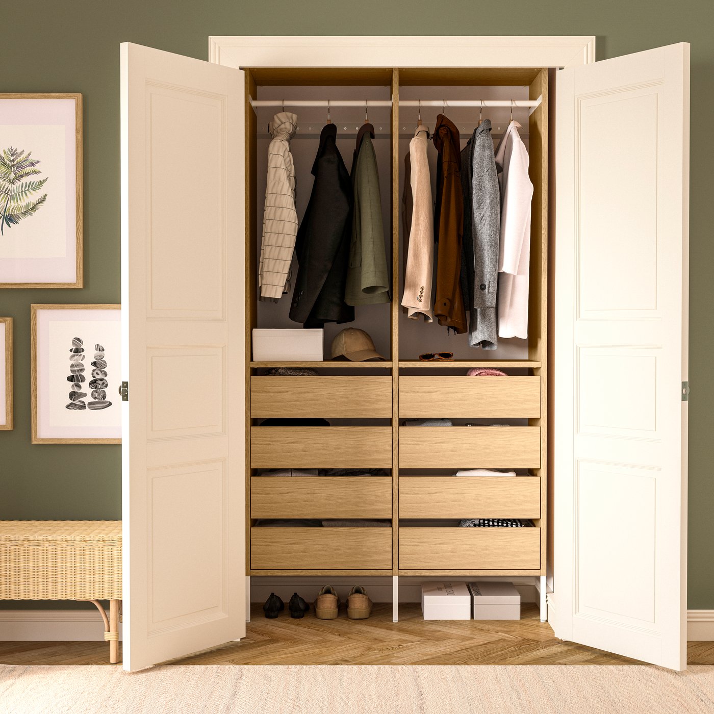 Open AURDAL wardrobe with hanging clothes, six wooden drawers, and storage boxes in a green-walled room