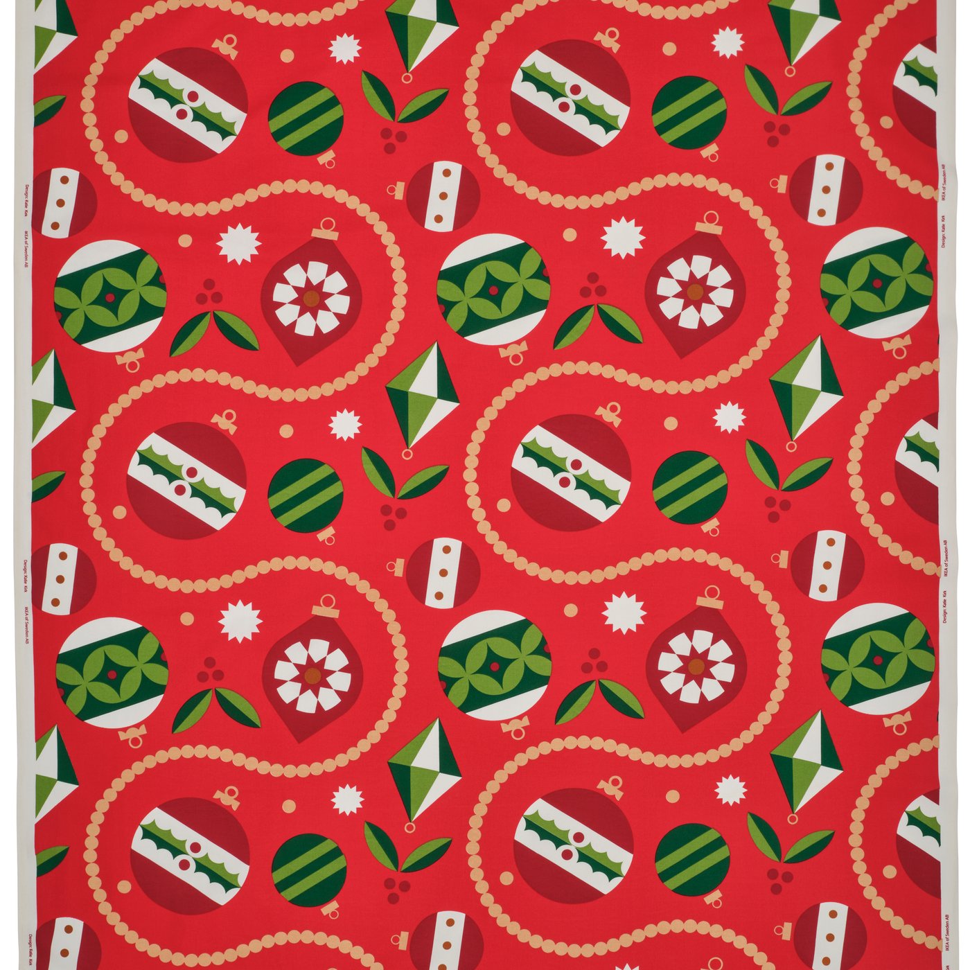 Närbild på ett rött tyg med julmönster.