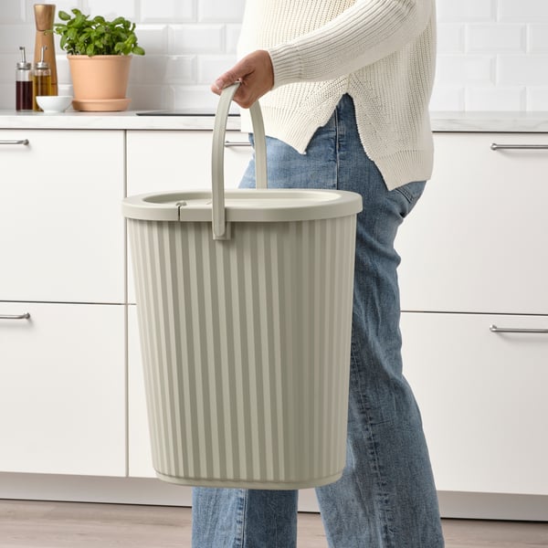 A gray-beige DAMMÄNG bin with lid