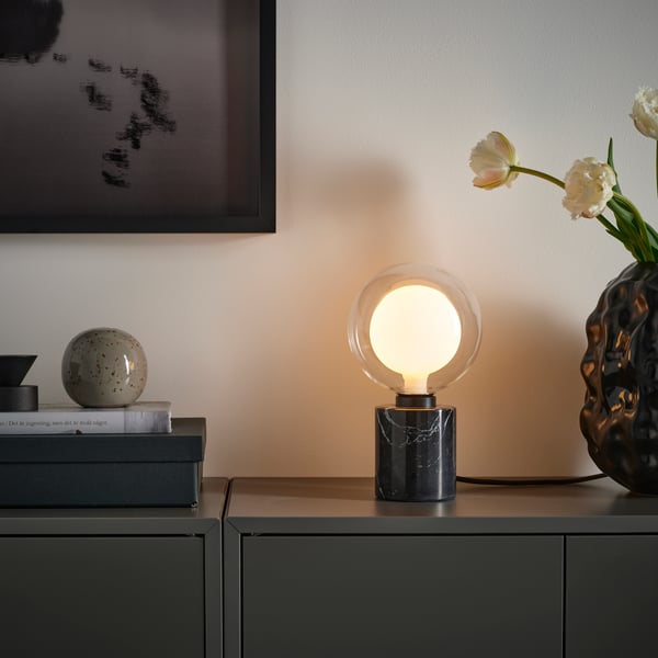 MOLNART LED bulb E27 200 lumen, double globe clear glass on a sideboard.