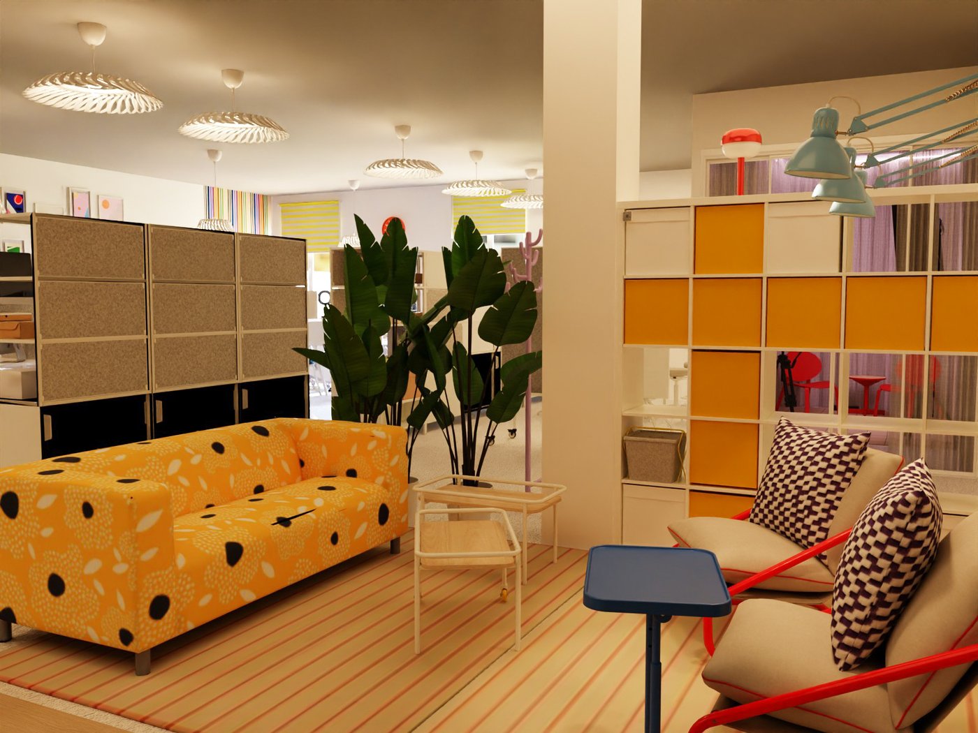 Teil eines Großraumbüros. Blick auf ein Sofa und zwei Sessel. In der Mitte Couchtische, um die Sitzmöbel herum Aufbewahrung als Abgrenzung zum anderen Teil des Büros. Oberhalb des Sofas Pinnwände.