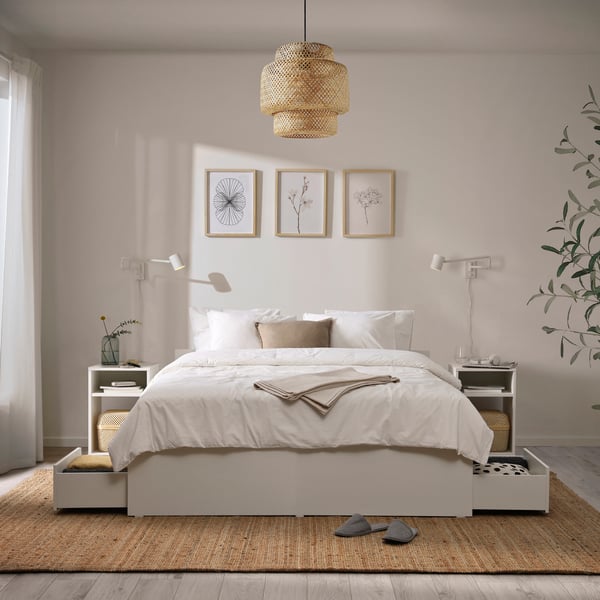 A white NYMÅNE wall lamp with swing arm