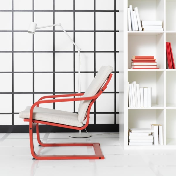 A red stained POÄNG armchair frame with low back