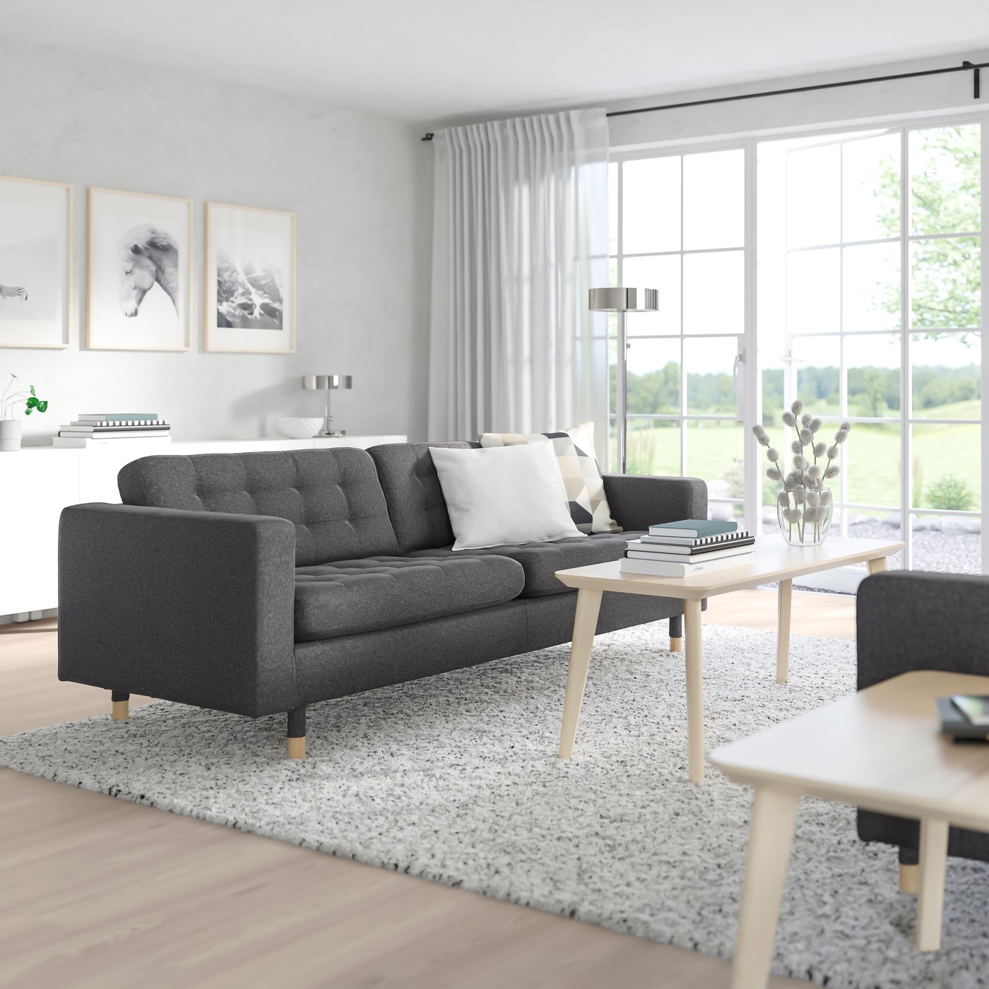 A Gunnared dark grey/wood MORABO 3-seat sofa in the living room