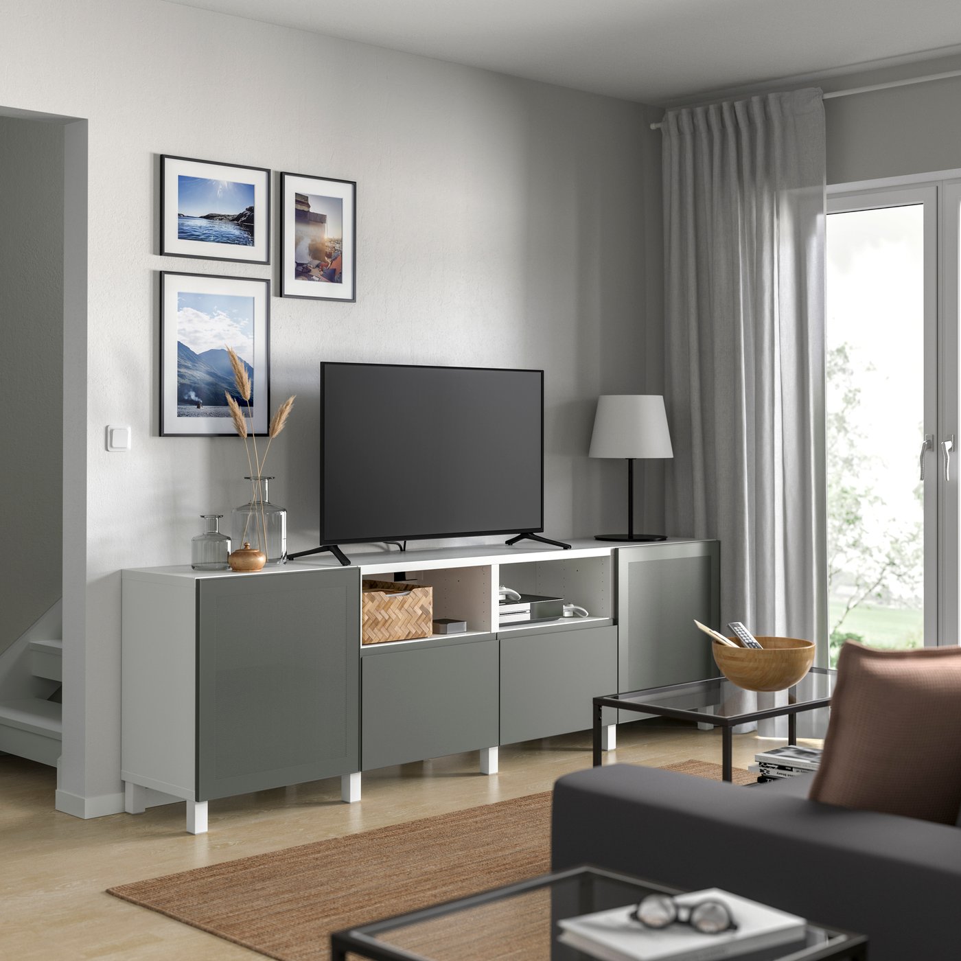 A white Mörtviken/Västerviken/Stubbarp dark grey BESTÅ TV bench with doors and drawers