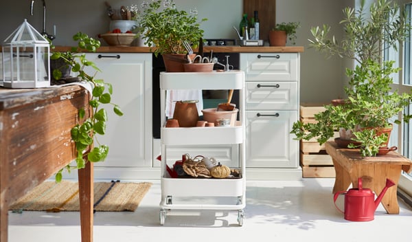A white RÅSKOG cart in a bright kitchen.